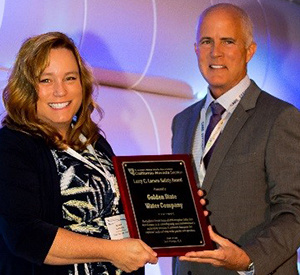 Brandy Hancocks, Golden State Water, Environmental, Health & Safety Compliance Manager accepting the Larry C. Larson Safety Award