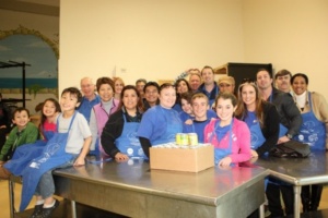 SJWC employees and their family members, young and old, pitch in to help feed the hungry at Martha’s Kitchen.